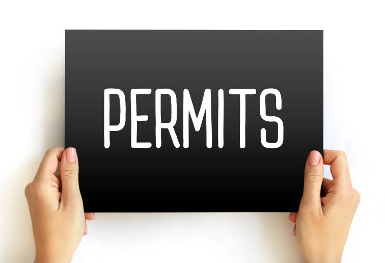 Photo of sign with the word PERMITS on it