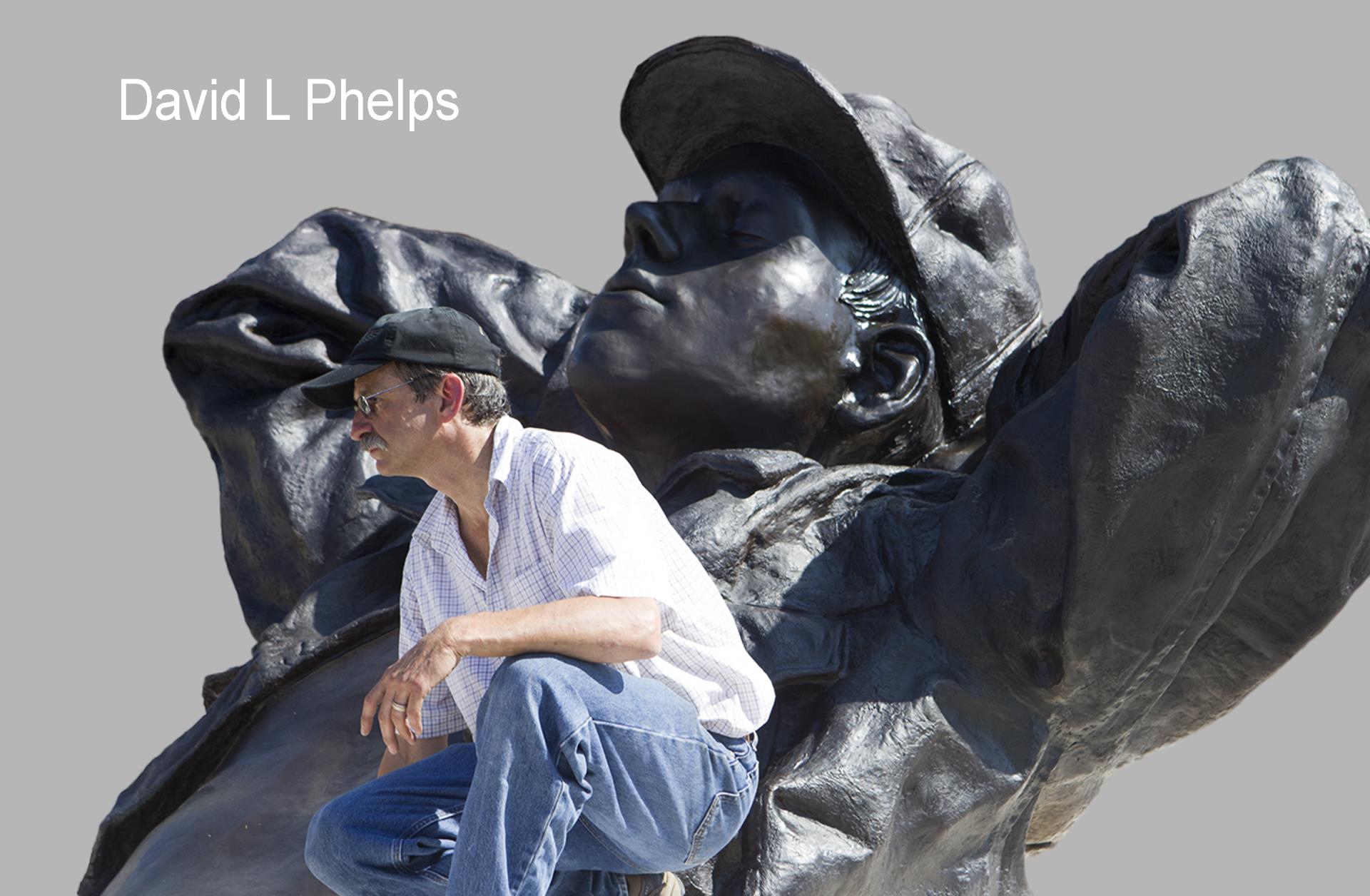 David Phelps Artist next to large sculpture