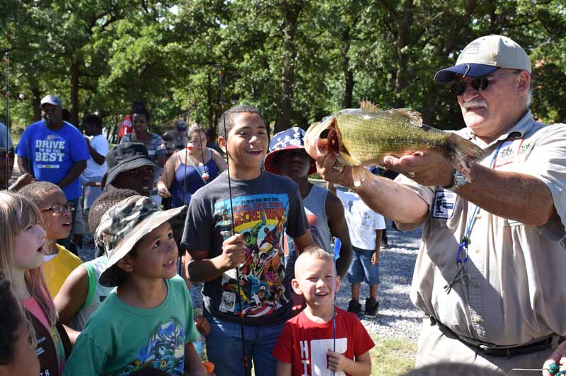 Children enjoy free summer fishing lessons